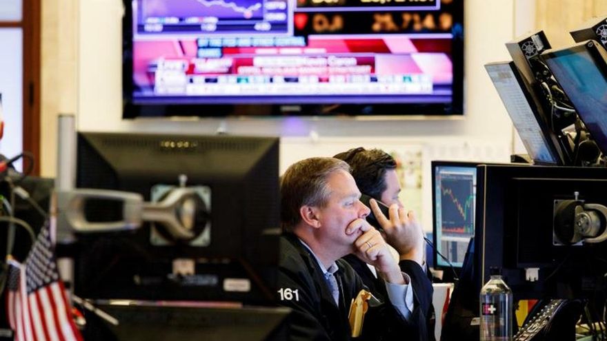 Traders work on the floor of the New York Stock Exchange in New York, New York, USA, 05 August 2019.