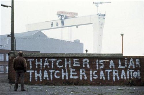 A denouncement of British Prime Minister Margaret Thatcher, painted on a wall of the Harland and Wolf shipyard in Belfast, Northern Ireland in 1985. The slogans had been daubed there following the signing of an Anglo-Irish agreement. (AP Photo/Peter Kemp)
