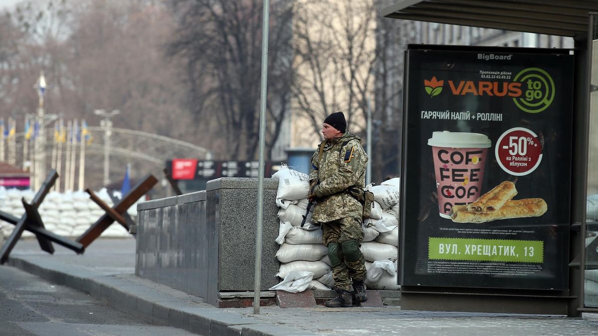 Ukraine's Territorial Defense Forces member stands at a checkpoint in a street in Kyiv (Kiev), Ukraine, 24 March 2022, after a month of war