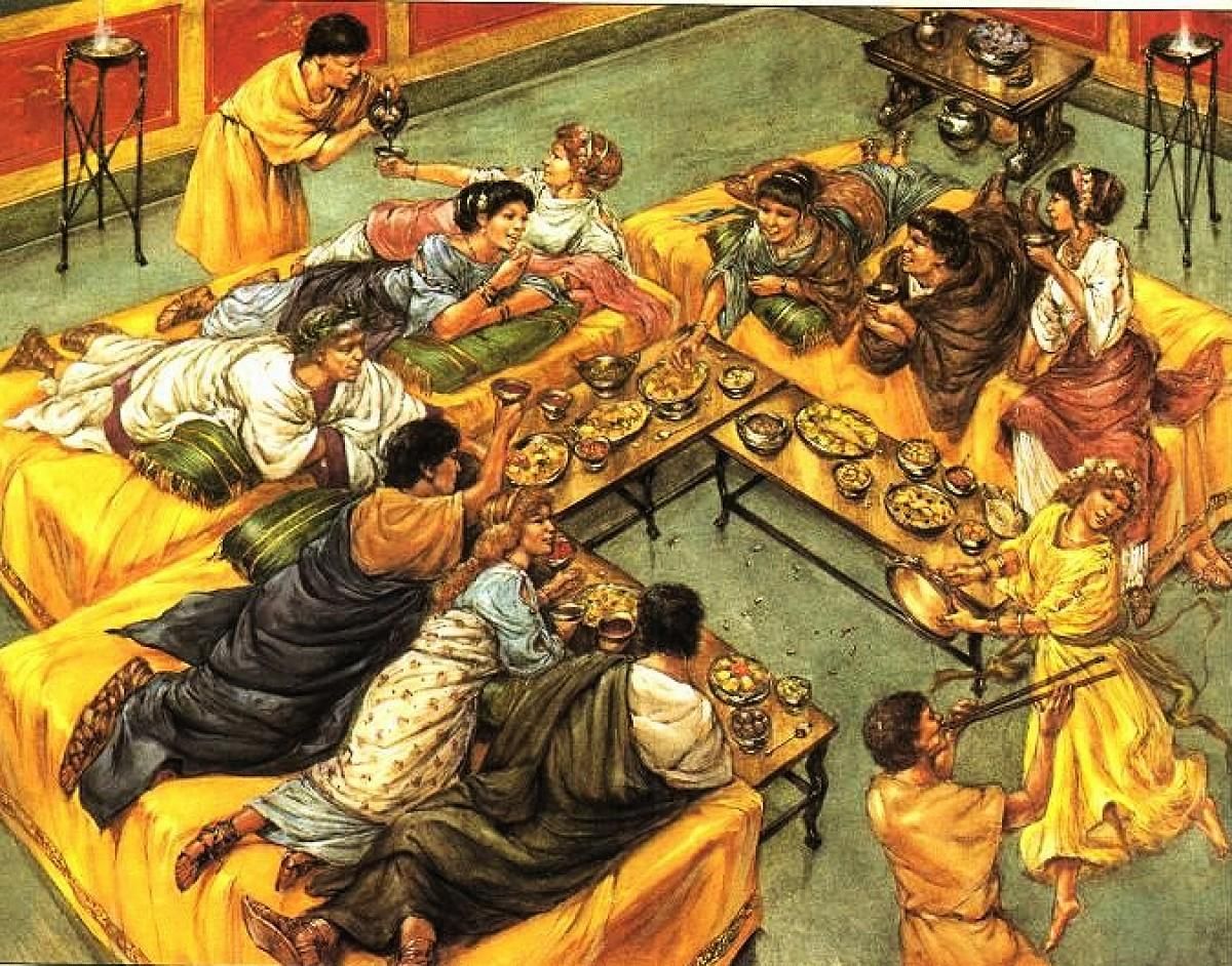Ilustración de un triclinium romano, la sala de los banquetes de una villa romana. Nótese que la ilustración es de un libro infantil ya algo antiguo y muestra a los romanos recostados ante unas mesas, mientras que la imagen de IA de arriba expuesta en el Museo de Valladolid es prácticamente lo contrario, además de estar sentados no hay mesitas para coger los alimentos; y la sala romana sería interior.