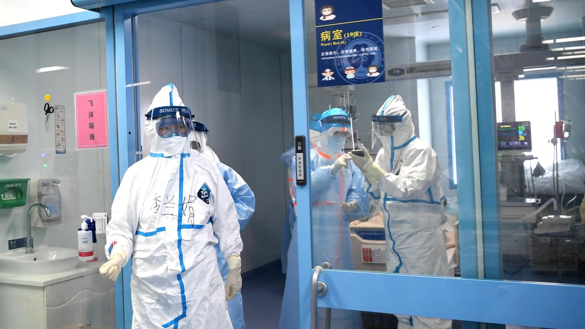 Doctors with protective suits check the ICU ward at the people's hospital of Wuhan University in Wuhan, amid the outbreak of the coronavirus.
