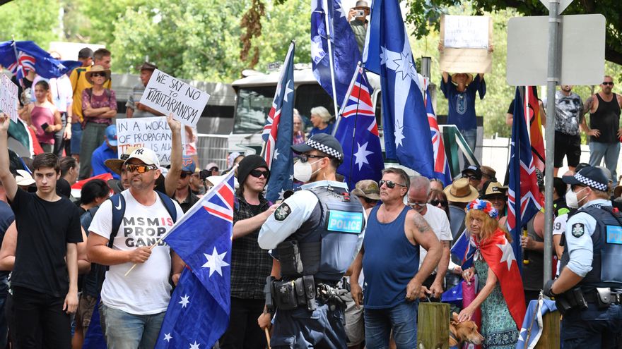 Protesters are seen during an anti-vaccination rally outside the National Press Club of Australia where Prime Minister Scott Morrison will speak in Canberra, Tuesday, February 1, 2022. (AAP Image/Mick Tsikas) NO ARCHIVING
