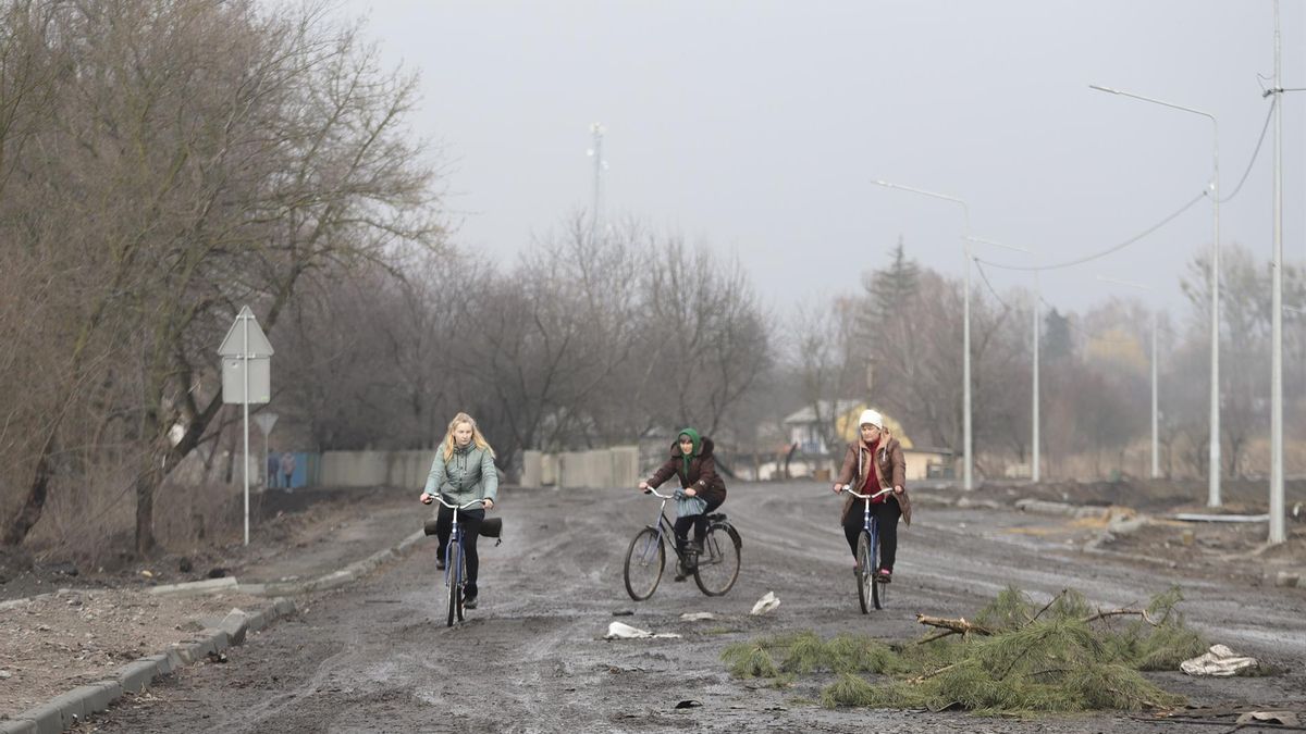 Locals ride bicycles in the recaptured by the Ukrainian army Nova Basan village of Kyiv (Kiev) area, Ukraine, 01 April 2022.
