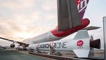 A handout photo made available by Virgin Orbit on 25 May 2020 shows a LauncherOne rocket moved into position next to Cosmic Girl, a customized Boeing 747 aircraft that is used as the rocket's 'flying launch pad', at Mojave Air and Space Port in California, USA.