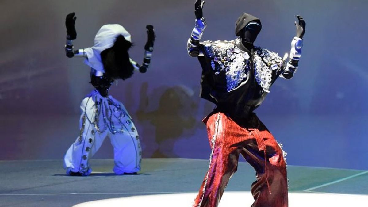 Robots bailando en un concierto de K-pop.