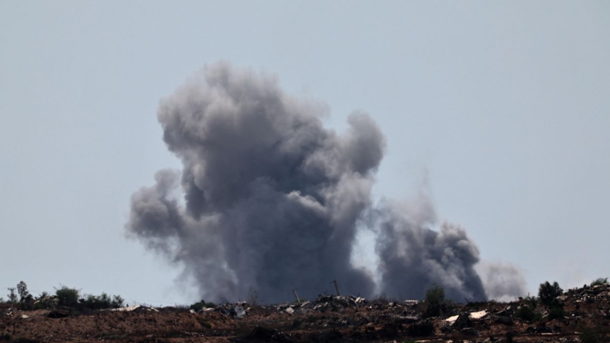 The smoke rises after the explosions in the north of the Gaza Strip, seen from the Israeli side of the border.