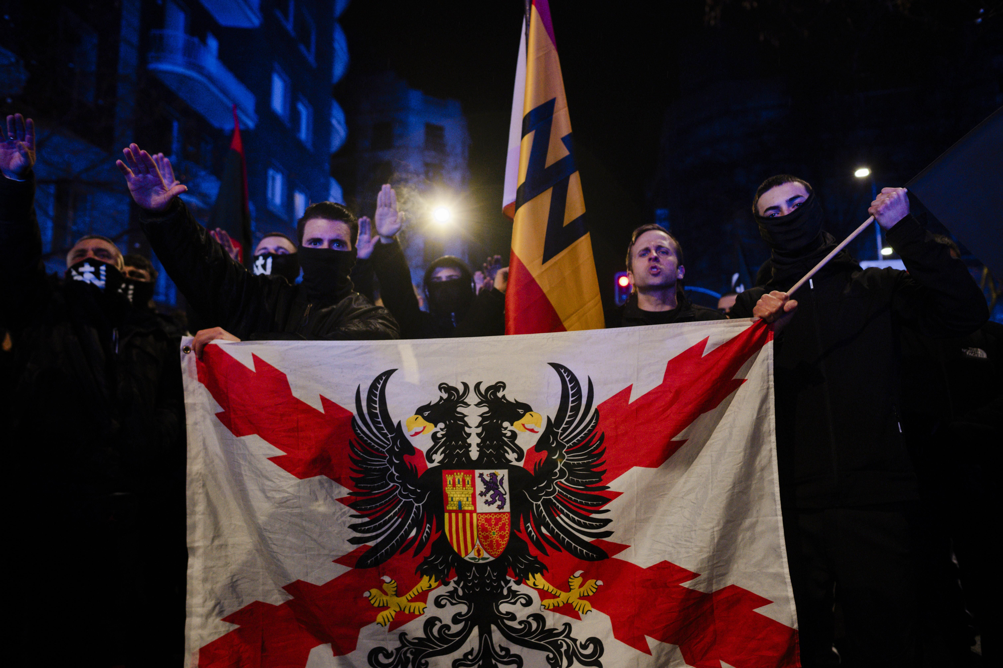 Miembros del colectivo neonazi Núcleo Nacional en una manifestación contra la regularización de migrantes, el 7 de febrero en Madrid