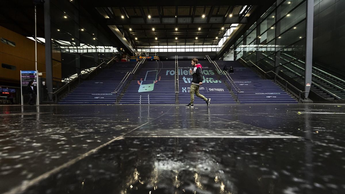 A lone person walks past Southern Cross Station in Melbourne, Victoria, Australia, 04 October 2021. Melbourne has become the most locked down city in the world since the beginning of the COVID-19 pandemic, surpassing the 245-day record set by Argentina's Buenos Aires.