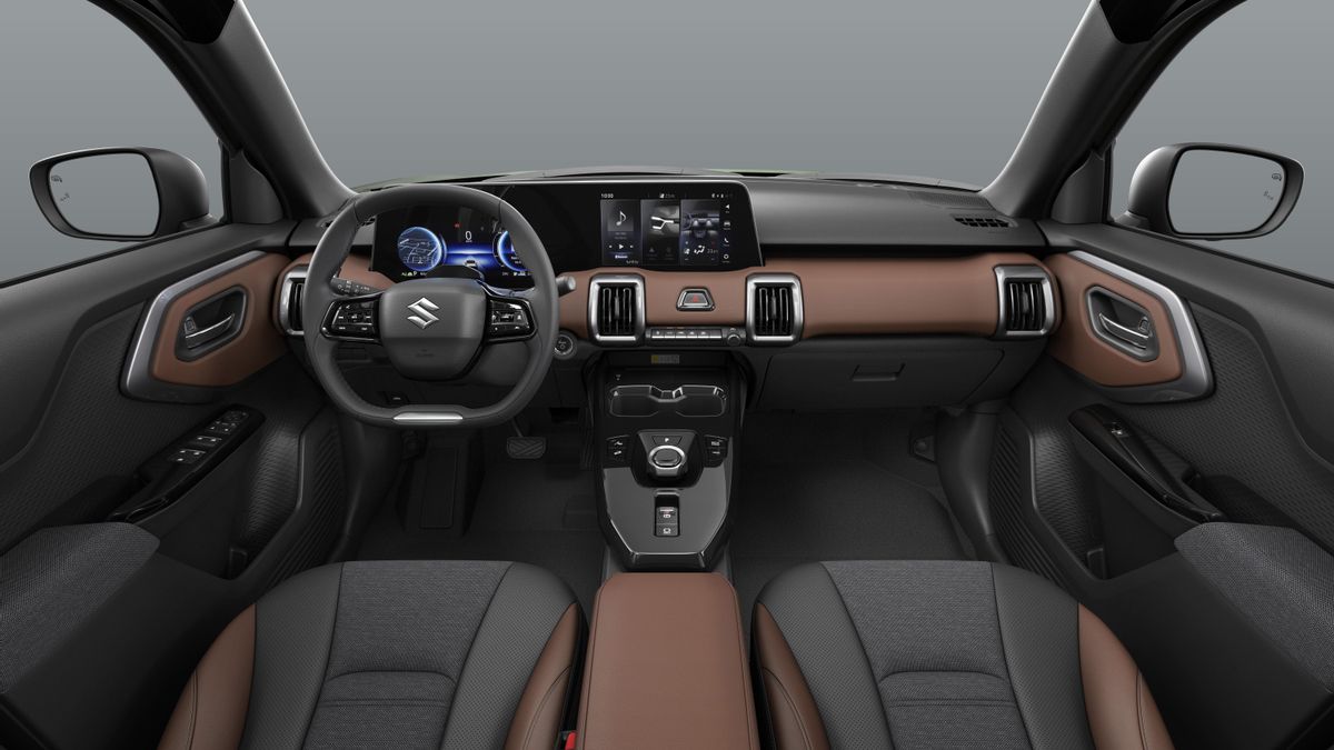 Aspecto del habitáculo acabado en colores negro y marrón.