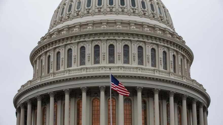 The US flag flies outside of the US Capitol in Washington, DC, USA, 14 January 2020.