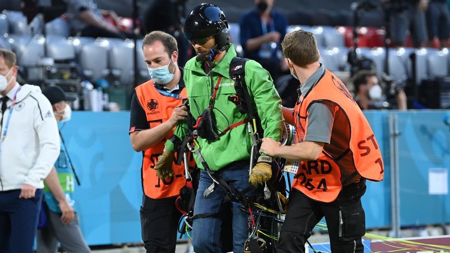 A Greenpeace activist is removed from the pitch by stewards the UEFA EURO 2020 group F preliminary round soccer match between France and Germany in Munich, Germany, 15 June 2021.