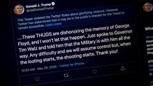A photograph of a computer screen shows the tweet and the warning that Twitter placed on US President Donald J. Trump's tweet from earlier this morning in Washington, DC (USA). President Trump's tweet implied that looters in Minneapolis, Minnesota could be shot.