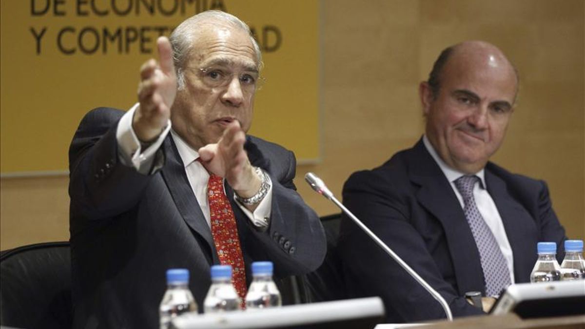 El secretario general de la OCDE y el ministro de Economía Luis de Guindos