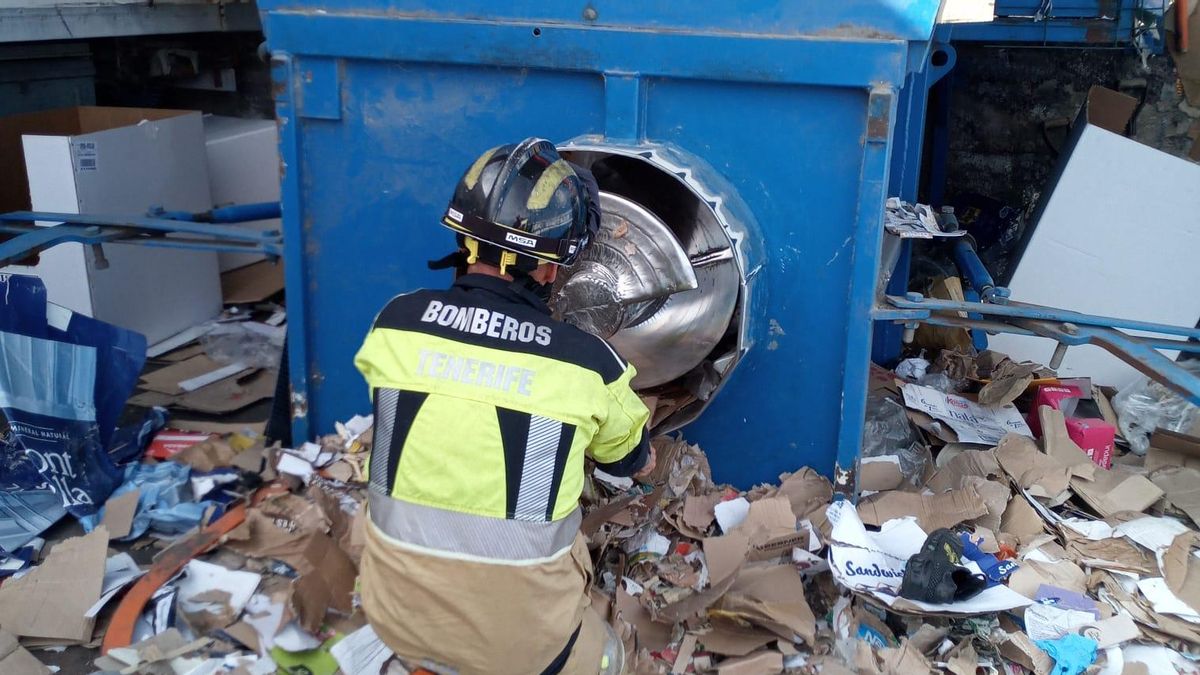Firefighters rescue a man trapped in a paper compactor in Tenerife