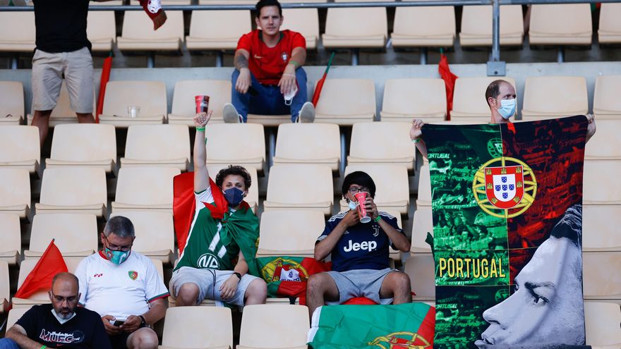 A fan of Portugal shows a Cristiano Ronaldo flag before the UEFA EURO 2020, Round of 16 football match between Belgium and Portugal at La Cartuja stadium on June 27, 2021 in Seville, Spain.