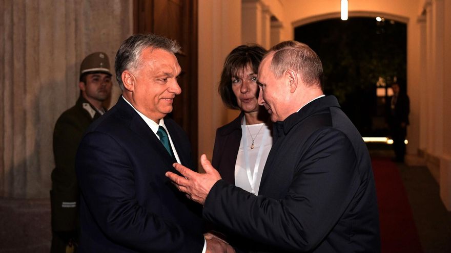 HANDOUT - 30 October 2019, Hungary, Budapest: Hungarian Prime Minister Viktor Orban (L) and Russian President Vladimir Putin shake hands after attending a meeting with leaders of the Middle Eastern Christian church.
