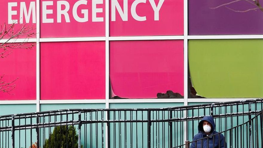 A Person waits in line to enter a triage tent and COVID-19 testing area outside of the emergency room at Elmhurst Hospital Center in Queens, New York, USA, on 14 April 2020.