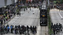 Protesters standoff with riot police during a rally against the implementation of a new national security law in Causeway Bay, Hong Kong, China, 24 May 2020.