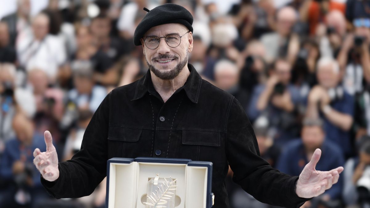 John Travolta con la Palma de Oro honorífica de Cannes
