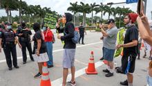 Protesters attend a demonstration in response to the death of George Floyd, in front of the Trump National Doral Miami hotel and golf center in Doral, Florida, USA, 06 June 2020.