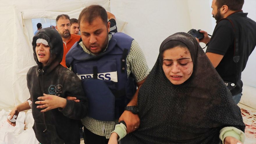 October 26, 2023, Dair El-Balah, Gaza Strip, Palestinian Territory: Relatives of Al-Jazeera correspondent Wael Al-Dahdouh mourns over the bodies his three children who were killed along with his wife and some Relaives in an Israeli strike in the Nuseirat camp, at Al-Aqsa hospital in Deir Al-Balah on the southern Gaza Strip