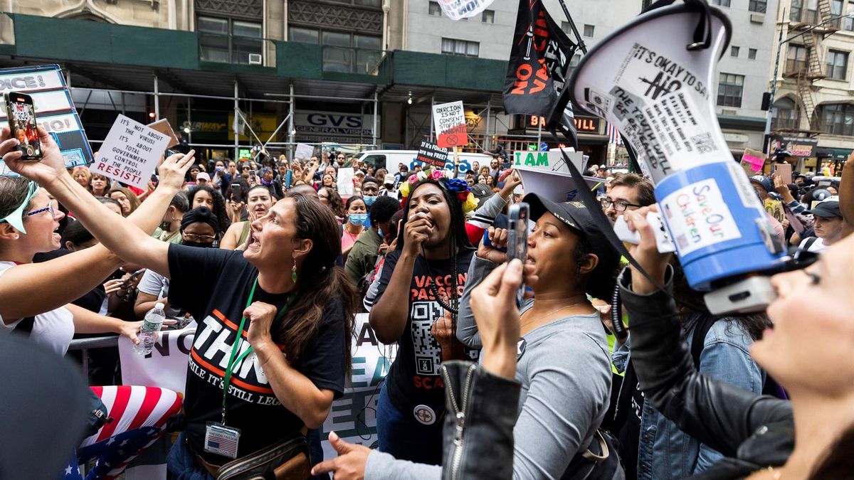 People gather for a protest against the New York City'Äôs COVID-19 vaccine mandate for public school employees in front of the Department of Education offices in the Brooklyn borough of New York, New York, USA, 04 October 2021.