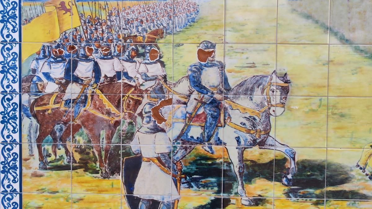 El mural con los desperfectos en las caras
