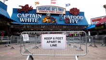 A sign directs people to observe social distancing guidelines at the Wharf in Washington, DC, USA, 29 May 2020.