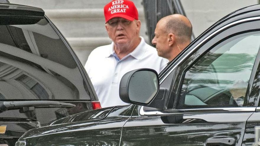 US President Donald J. Trump (C), wearing a red baseball cap with white letters that read 'Keep America Great.', departs the White House en route to the Trump National Golf Club in Sterling, Virginia, in Washington, DC, USA, 14 September 2019.
