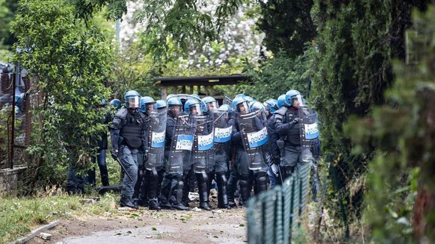 Police evicting squatters from a former school on the outskirts of Rome