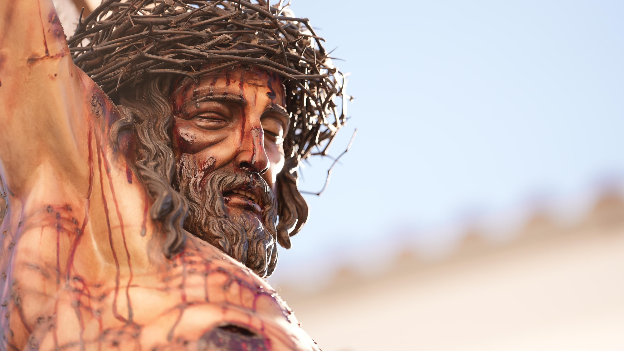 La estación de penitencia de la Hermandad Universitaria, en imágenes