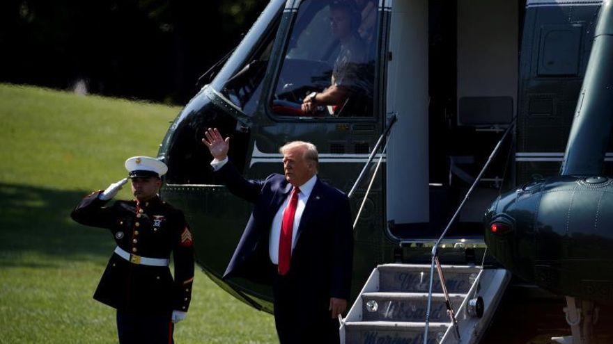 US President Donald J. Trump waves to supporters as he boards Marine One on the South Lawn of the White House in Washington, DC, USA, 09 August 2019.