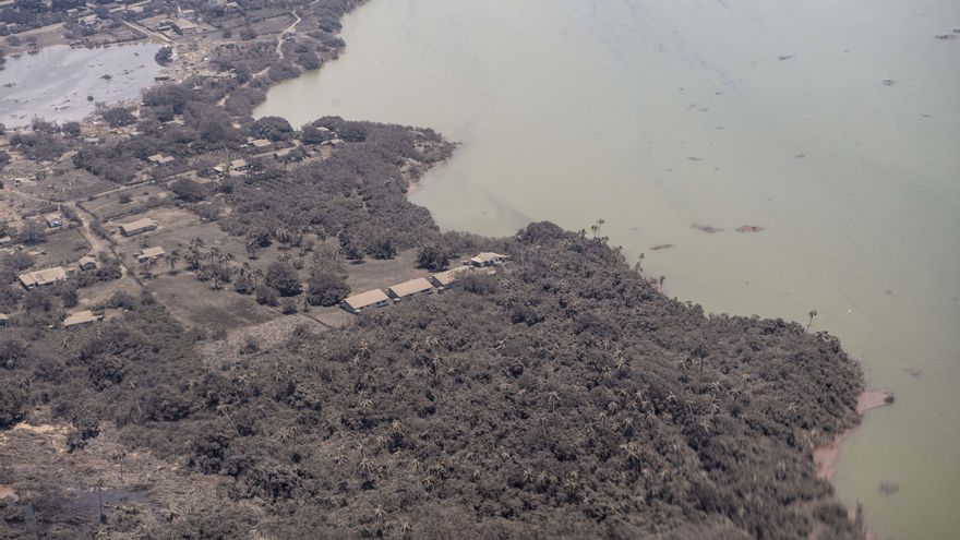 A supplied image shows the view from a P-3K2 Orion aircraft flying over Nomuka, Tonga with ash on the rooves of homes and surrounding vegetation, Monday, January 17, 2022. (AAP Image/Supplied by NZDF, Vanessa Parker) NO ARCHIVING, EDITORIAL USE ONLY