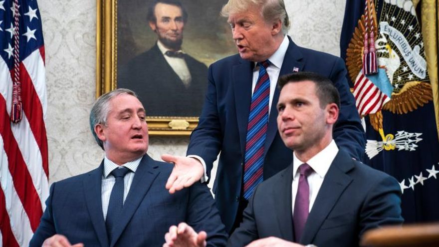 US President Donald J. Trump (C) looks on as Acting Homeland Security Secretary Kevin McAleenan (R) and Guatemalan interior minister Enrique Degenhart (L) sign a deal to limit asylum claims from Guatemala in the Oval Office of the White House in Washington, DC, USA, 26 July 2019.
